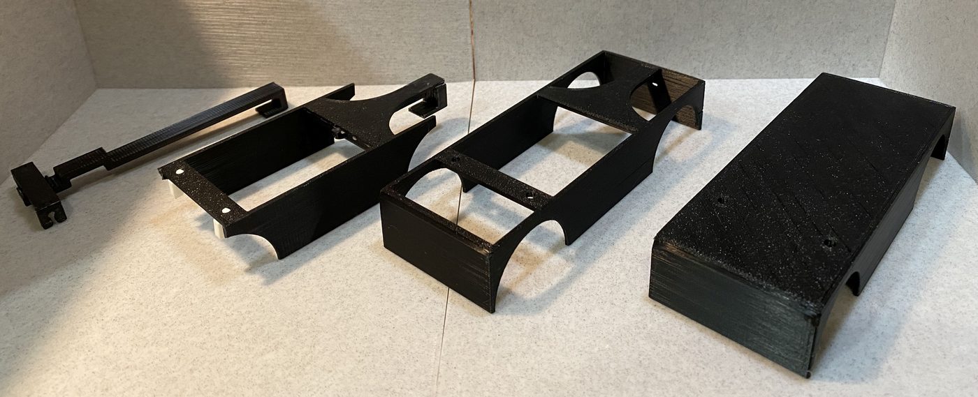 The four versions in black, left to right: spine rail, short shell, long shell, enclosed platform.