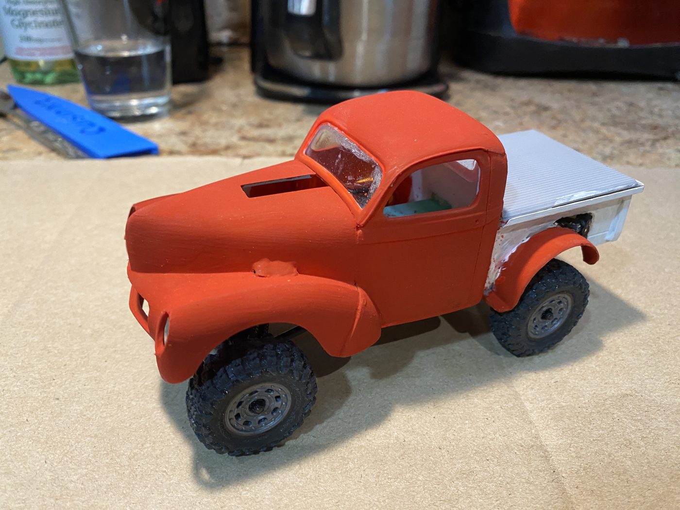 A 1940 Willys pickup model kit body mounted on the crawler chassis with off-road tyres.